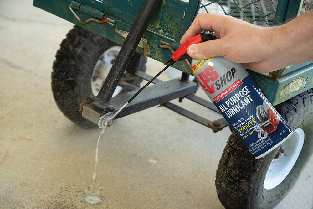 LPS Shop All Purpose Lubricant spraying a wagon hinge.