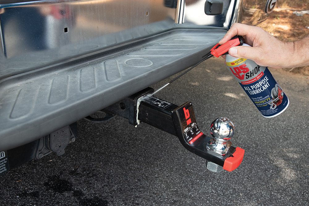 LPS Shop All Purpose Lubricant spraying a tow hitch.